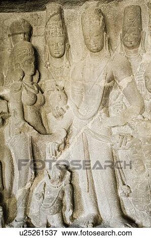 Statues carved on the wall in a cave, Ellora, Aurangabad, Maharashtra, India View Large Photo Image Stock Photo - Statues carved on the wall in a cave, Ellora, Aurangabad, Maharashtra, India. Fotosearch