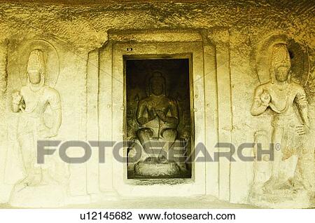 Stock Image - Statues in a cave, Ellora, Aurangabad, Maharashtra, India. Fotosearch