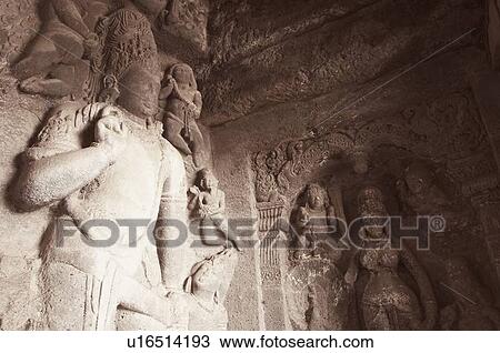 Stock Image - Statues in a cave, Ellora, Aurangabad, Maharashtra, India. Fotosearch