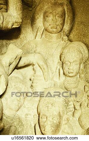 Stock Image - Statues in a cave, Ellora, Aurangabad, Maharashtra, India. Fotosearch