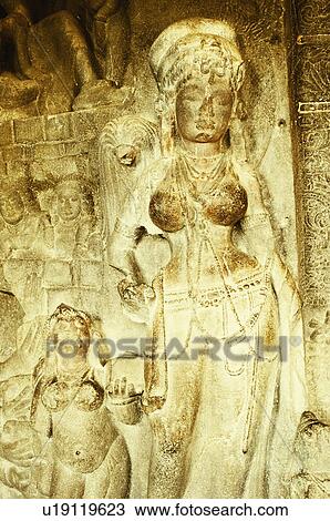 Stock Image - Statues in a cave, Ellora, Aurangabad, Maharashtra, India. Fotosearch