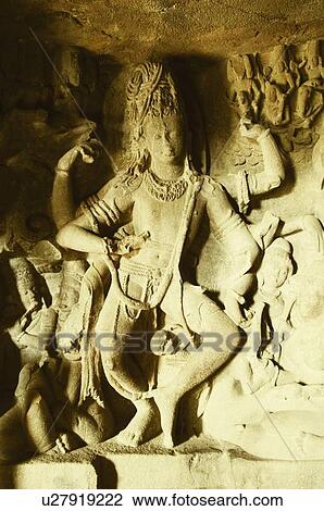 Stock Image - Statues in a cave, Ellora, Aurangabad, Maharashtra, India. Fotosearch