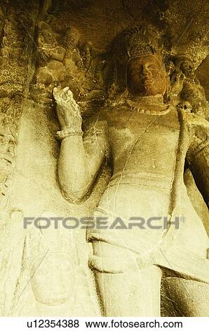 Stock Photo - Statues in a cave, Ellora, Aurangabad, Maharashtra, India. Fotosearch