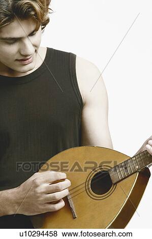 Close-up of a male musician playing the banjo View Large Photo Image Stock Photo - Close-up of a male musician playing the banjo. Fotosearch