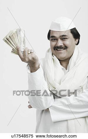 Close-up of a mature man showing Indian currency View Large Photo Image Stock Photography - Close-up of a mature man showing Indian currency. Fotosearch