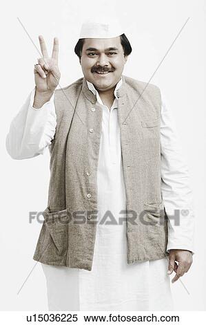 Stock Photography - Portrait of a male politician showing a peace sign. Fotosearch