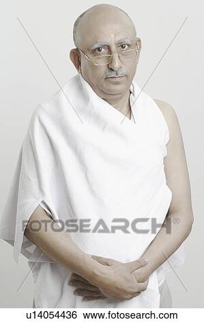 Portrait of a mature man impersonating Mahatma Gandhi View Large Photo Image Stock Photograph - Portrait of a mature man impersonating Mahatma Gandhi. Fotosearch