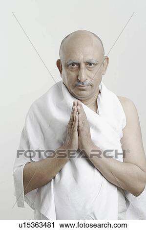 Portrait of a mature man in a prayer position View Large Photo Image Stock Image - Portrait of a mature man in a prayer position. Fotosearch
