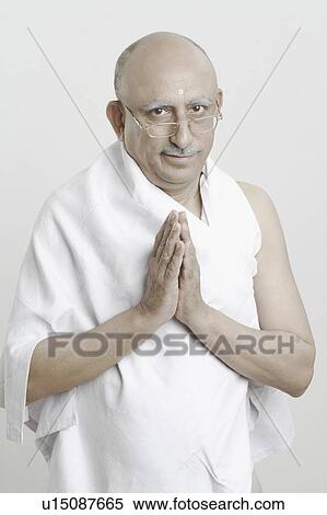 Portrait of a mature man in a prayer position View Large Photo Image Stock Photography - Portrait of a mature man in a prayer position. Fotosearch