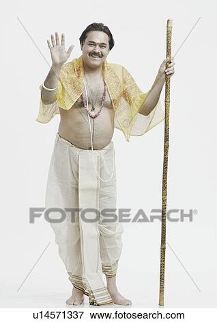 Portrait of a priest holding a stick View Large Photo Image Stock Photo - Portrait of a priest holding a stick. Fotosearch