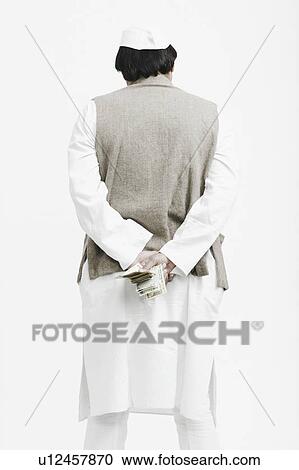 Rear view of a mature man holding Indian currency View Large Photo Image Stock Image - Rear view of a mature man holding Indian currency. Fotosearch