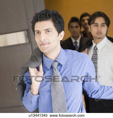 Business executives moving out from a conference room View Large Photo Image Stock Photography - Business executives moving out from a conference room. Fotosearch