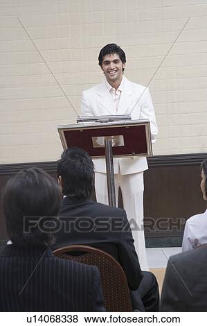 Businessman giving a speech in a seminar View Large Photo Image Stock Photo - Businessman giving a speech in a seminar. Fotosearch