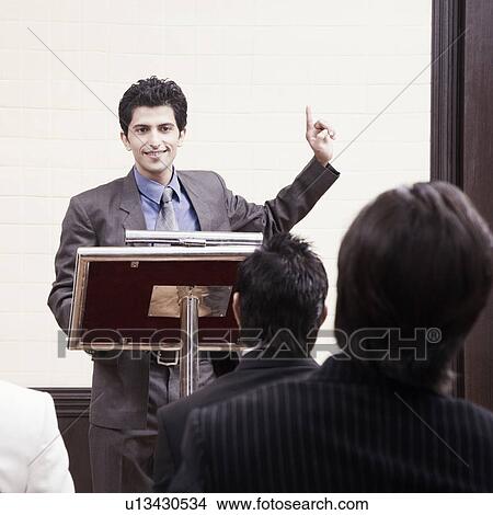 Businessman giving speech in a seminar View Large Photo Image Picture - Businessman giving speech in a seminar. Fotosearch