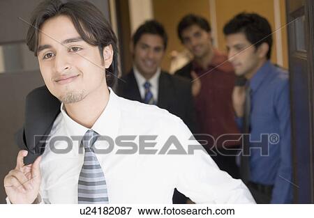 Stock Photo - Close-up of business executives moving out from a conference room. Fotosearch