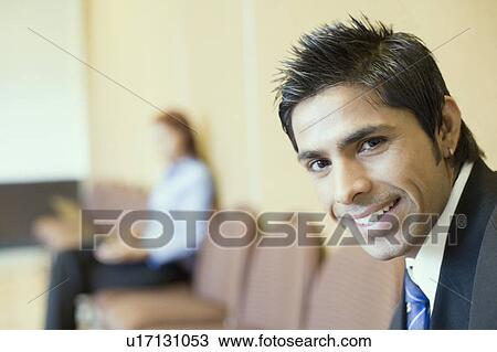 Stock Image - Portrait of a businessman smiling. Fotosearch