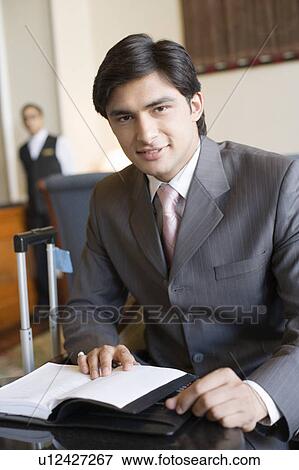 Portrait of a businessman smiling View Large Photo Image Stock Photo - Portrait of a businessman smiling. Fotosearch