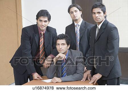 Portrait of four businessmen in an office View Large Photo Image Stock Photo - Portrait of four businessmen in an office. Fotosearch
