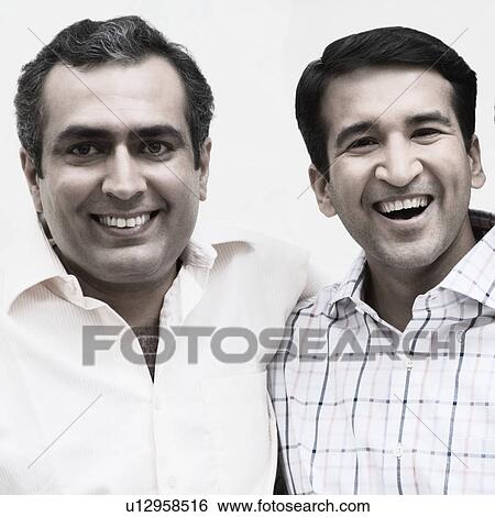 Portrait of two mid adult men smiling View Large Photo Image Stock Photograph - Portrait of two mid adult men smiling. Fotosearch