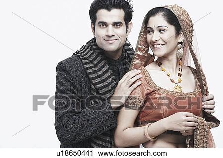 Close-up of a groom standing behind his bride View Large Photo Image Stock Image - Close-up of a groom standing behind his bride. Fotosearch