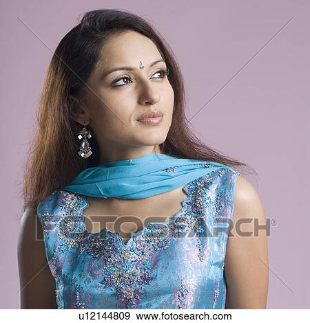 Stock Photo - Close-up of a mid adult woman in salwar kameez. Fotosearch