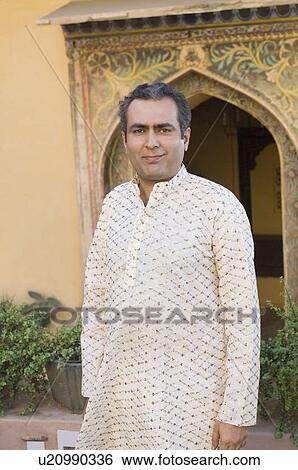 Stock Photograph - Portrait of a mid adult man, Neemrana Fort, Neemrana, Alwar, Rajasthan, India. Fotosearch