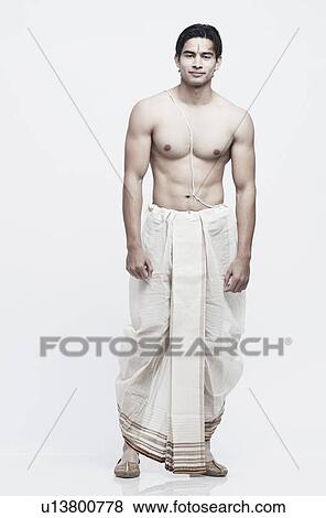 Portrait of a young man in traditional clothing View Large Photo Image Stock Photo - Portrait of a young man in traditional clothing. Fotosearch