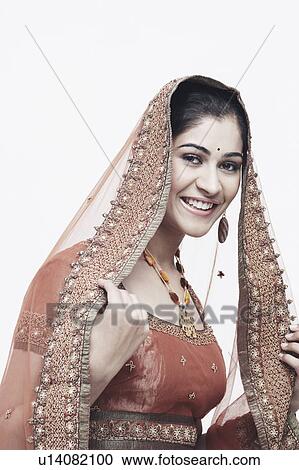 Portrait of a young woman in traditional clothing smiling View Large Photo Image Stock Image - Portrait of a young woman in traditional clothing smiling. Fotosearch