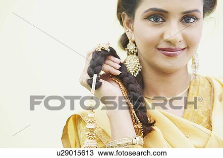 Portrait of a young woman smiling View Large Photo Image Stock Image - Portrait of a young woman smiling. Fotosearch