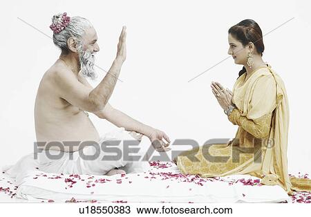 Side profile of a priest blessing a young woman View Large Photo Image Stock Image - Side profile of a priest blessing a young woman. Fotosearch