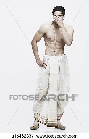 Young man in traditional clothing View Large Photo Image Stock Photo - Young man in traditional clothing. Fotosearch