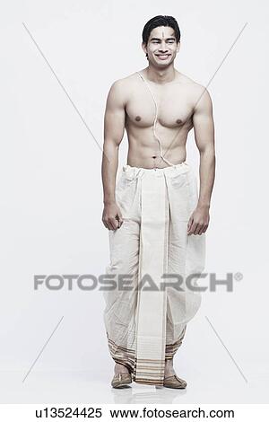Young man in traditional clothing View Large Photo Image Stock Photography - Young man in traditional clothing. Fotosearch