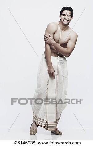 Stock Photography - Young man in traditional clothing. Fotosearch