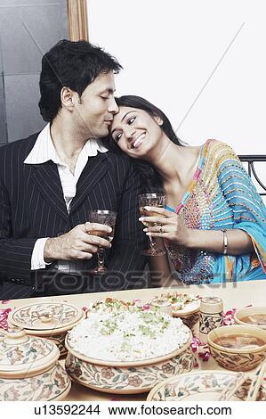Young man kissing a young woman on the forehead View Large Photo Image Picture - Young man kissing a young woman on the forehead. Fotosearch