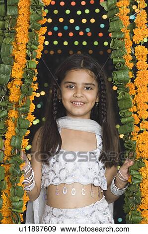 Close-up of a girl smiling View Large Photo Image Stock Photo - Close-up of a girl smiling. Fotosearch