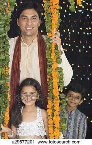 Portrait of a young man with his son and daughter View Large Photo Image Stock Image - Portrait of a young man with his son and daughter. Fotosearch