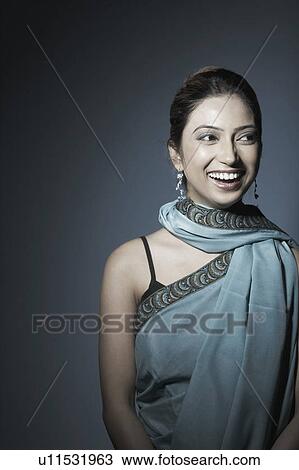 Close-up of a young woman laughing View Large Photo Image Stock Image - Close-up of a young woman laughing. Fotosearch