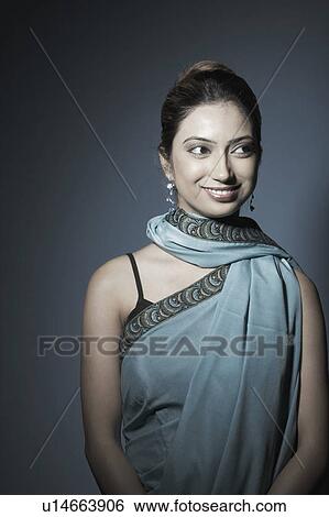 Stock Photograph - Close-up of a young woman smiling. Fotosearch