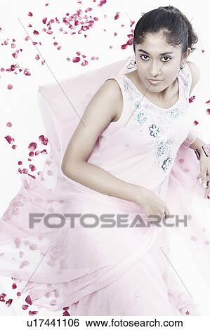 High angle view of a young woman posing View Large Photo Image Stock Photograph - High angle view of a young woman posing. Fotosearch