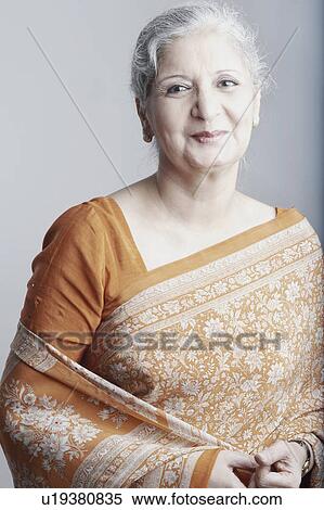 Portrait of a mature woman grinning View Large Photo Image Stock Photography - Portrait of a mature woman grinning. Fotosearch