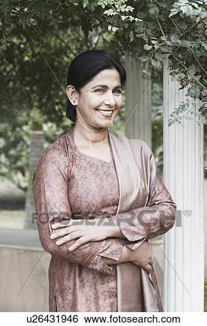 Portrait of a mature woman smiling View Large Photo Image Stock Photograph - Portrait of a mature woman smiling. Fotosearch