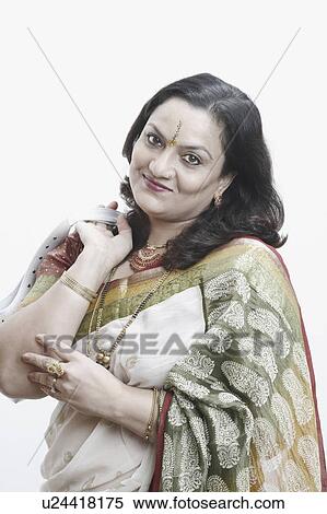 Stock Photography - Portrait of a mature woman with a purse in her hand. Fotosearch