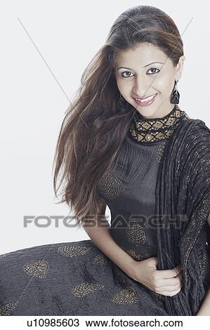 Portrait of a young woman smiling View Large Photo Image Stock Image - Portrait of a young woman smiling. Fotosearch