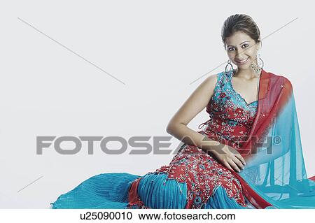 Stock Image - Portrait of a young woman smiling. Fotosearch