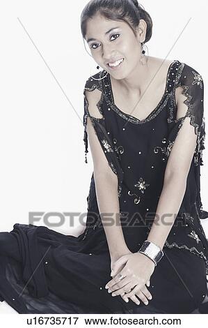 Stock Photo - Portrait of a young woman smiling. Fotosearch