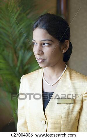 Stock Photography - Close-up of a waitress smiling. Fotosearch