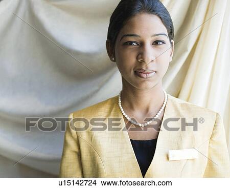 Portrait of a waitress looking confident View Large Photo Image Picture - Portrait of a waitress looking confident. Fotosearch