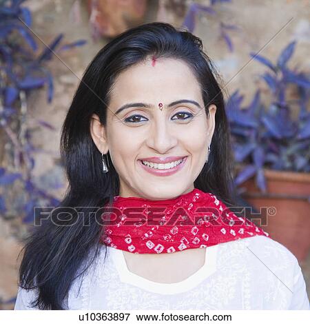 Stock Photo - Portrait of a young woman smiling. Fotosearch