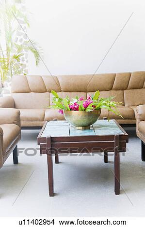 Bowl of flowers on a table in a living room View Large Photo Image Picture - Bowl of flowers on a table in a living room. Fotosearch