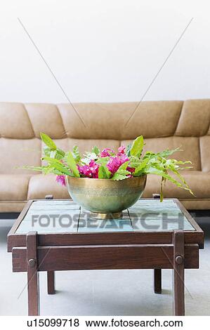 Bowl of flowers on a table in a living room View Large Photo Image Stock Photo - Bowl of flowers on a table in a living room. Fotosearch